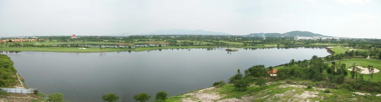 A panoramic view across the lake, island green and surrounding fairways at Amata Spring in April 2011.